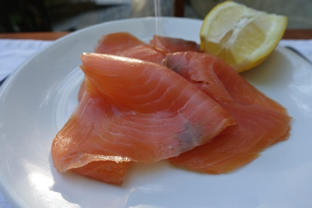 Sliced smoked salmon on plate