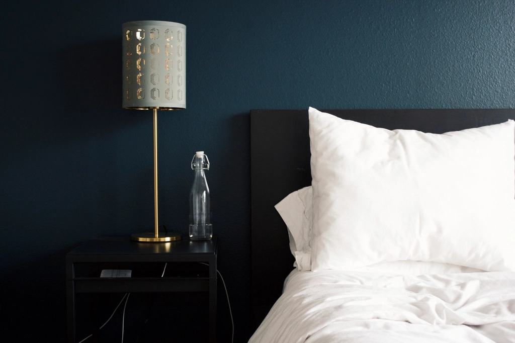 white bed, silver lamp, empty