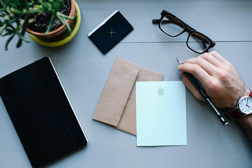 A university scholarship award letter on a desk beside an envelope