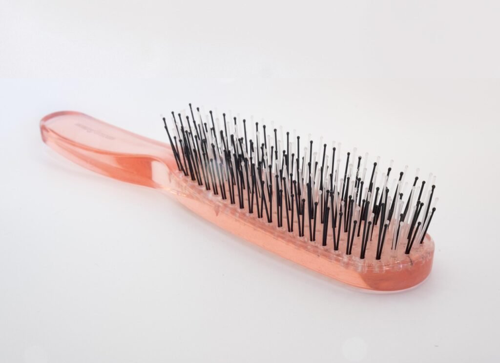 Hairbrush with tangled hair