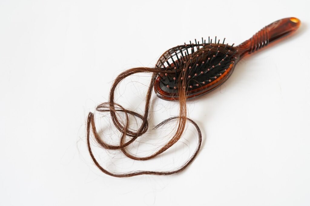 Wooden hairbrush drying on towel
