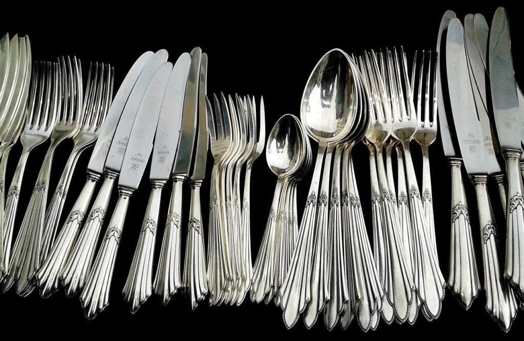 Tarnished silver spoons on cloth