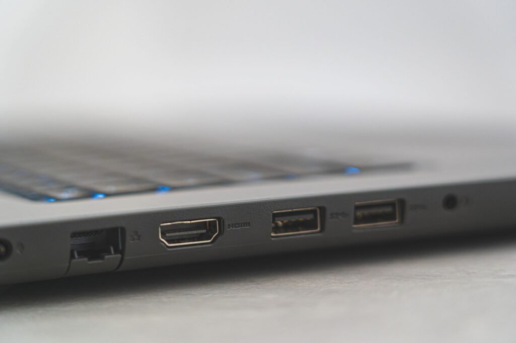 Close view of the side ports on a laptop including a video port and two USB ports