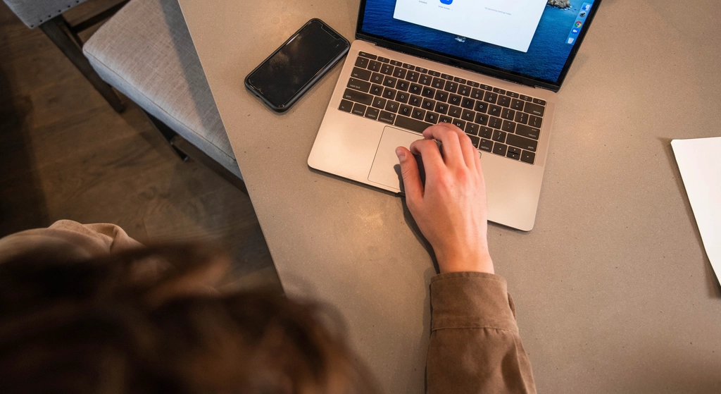 Person using laptop at desk