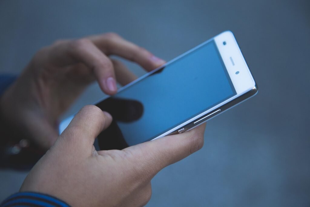 Hand holding smartphone screen
