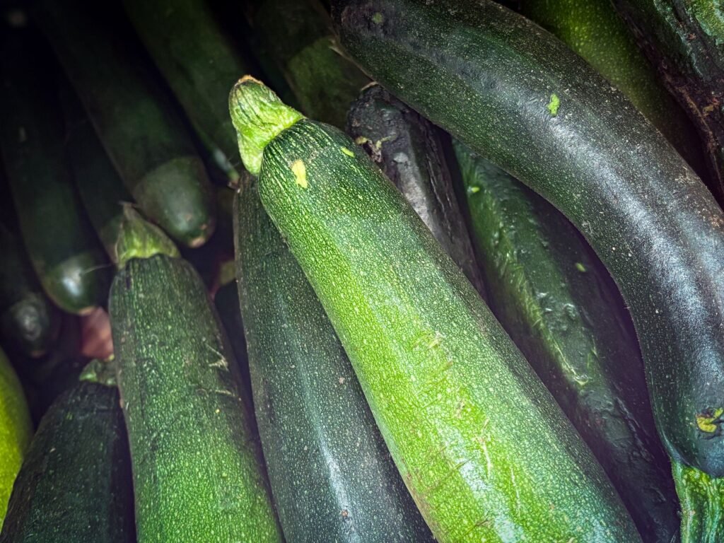 A close-up view of fresh green zucchinis showcasing their vibrant texture.