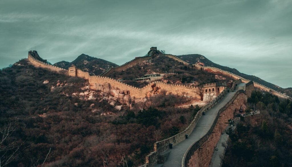 Stunning view of the Great Wall of China stretching across rugged mountains under an overcast sky