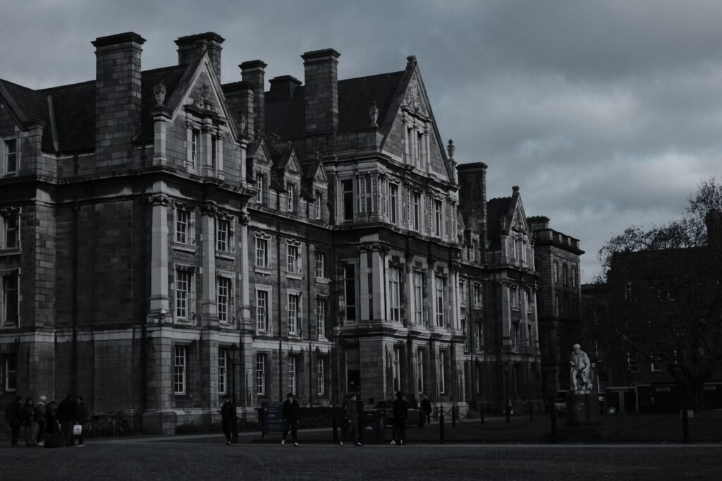 Gothic architecture of Trinity College, Dublin under moody clouds