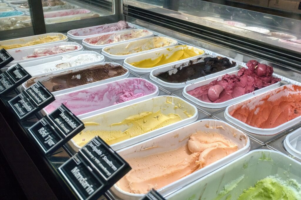 A vibrant display of assorted ice cream flavors in a Stockholm gelato shop