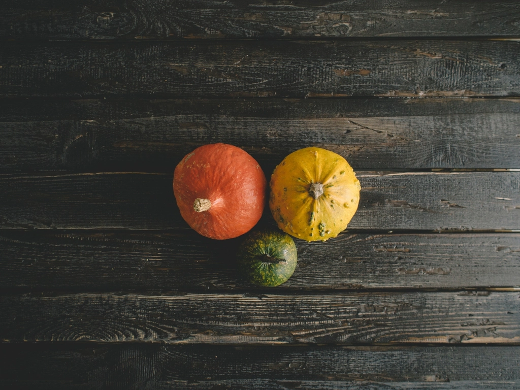 Pumpkins on wooden table