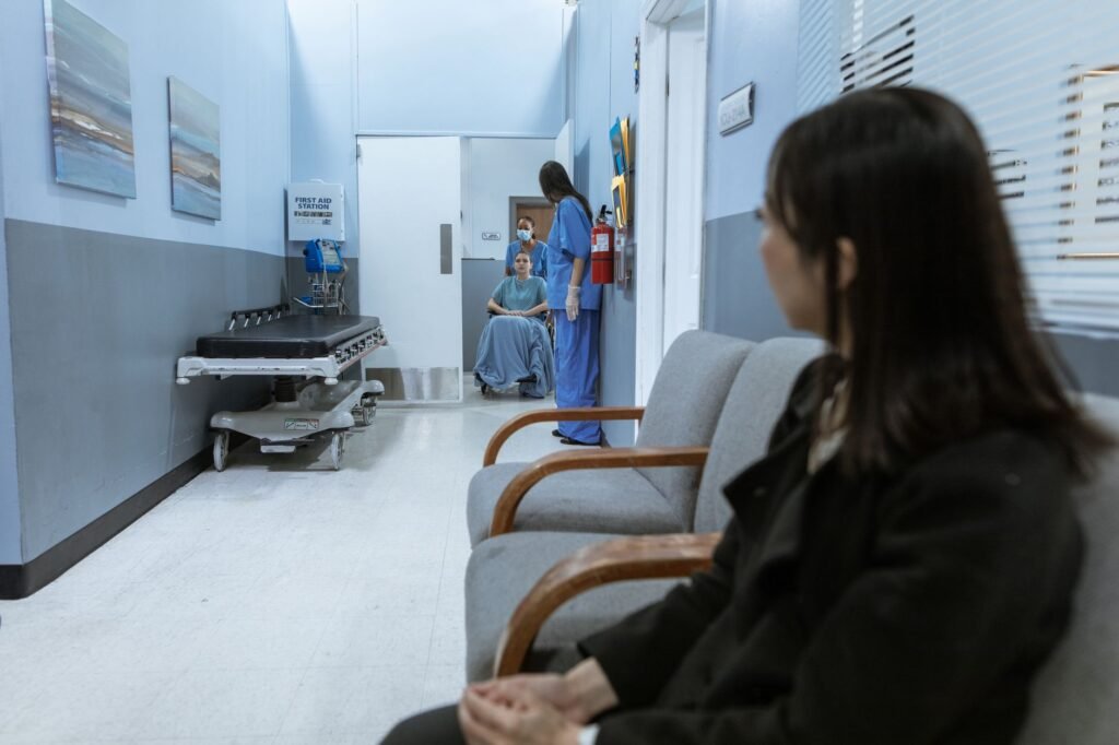 A hospital scene showing patients and medical staff in a corridor, illustrating healthcare environments