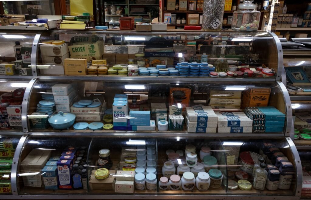 A nostalgic display of vintage products inside a retro-style store, showcasing old-fashioned packaging and ...