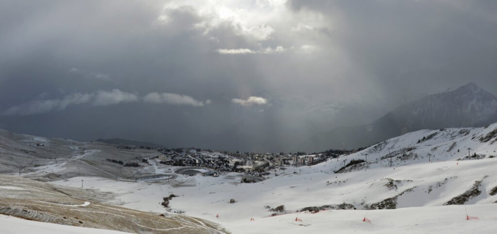 Sunlight through clouds above La Toussuire from le Marolay, 2023
