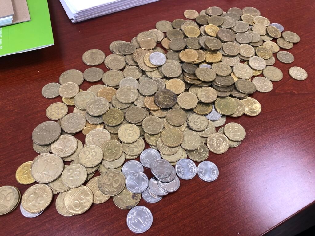 A pile of Ukrainian currency coins