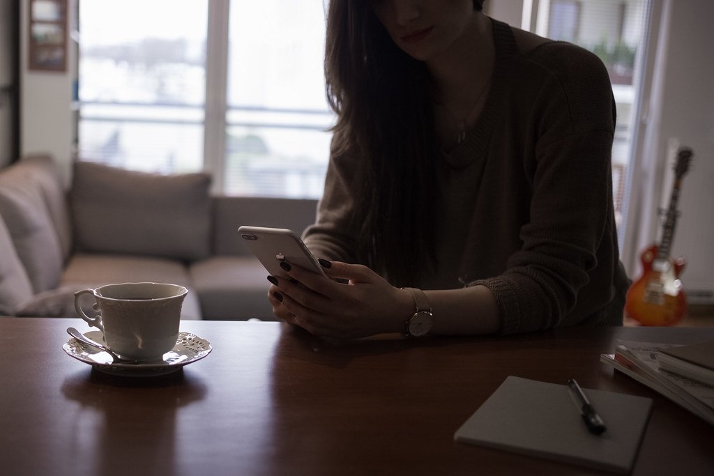 Female holding iPhone 8 plus